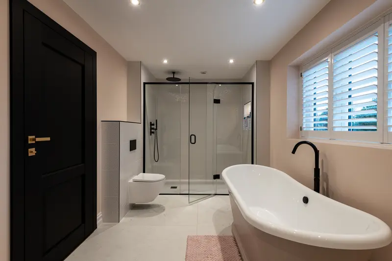 Bathroom with roll-top bath and walk-in shower
