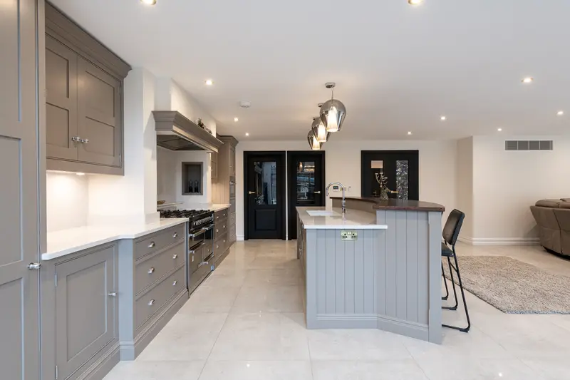 Open-plan kitchen with a large island and painted cabinets